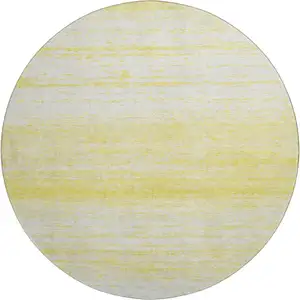 Photo of 8' Yellow And Ivory Striped Washable Round Rug With UV Protection