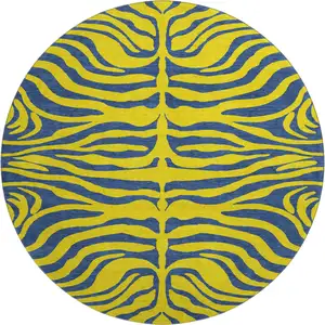 Photo of 8' Yellow And Navy Blue Animal Print Washable Round Rug With UV Protection