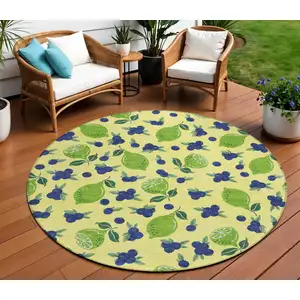 Photo of 8' Yellow Blue And Green Round Lemons Washable Indoor Outdoor Area Rug