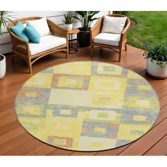8' Yellow Blue And Terra Cotta Round Geometric Washable Indoor Outdoor Area Rug Photo 1