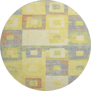 Photo of 8' Yellow Orange Purple And Ivory Geometric Washable Round Rug With UV Protection