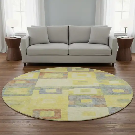 8' Yellow Orange Purple And Ivory Geometric Washable Round Rug With UV Protection Photo 2
