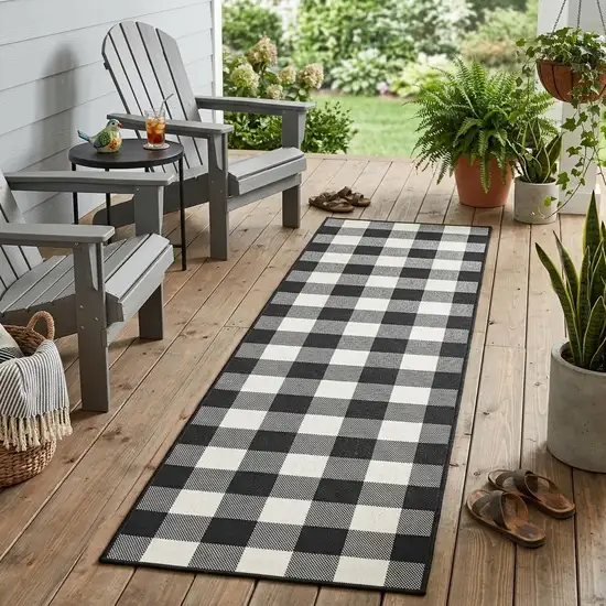 8' Black And Ivory Indoor Outdoor Runner Rug Photo 1