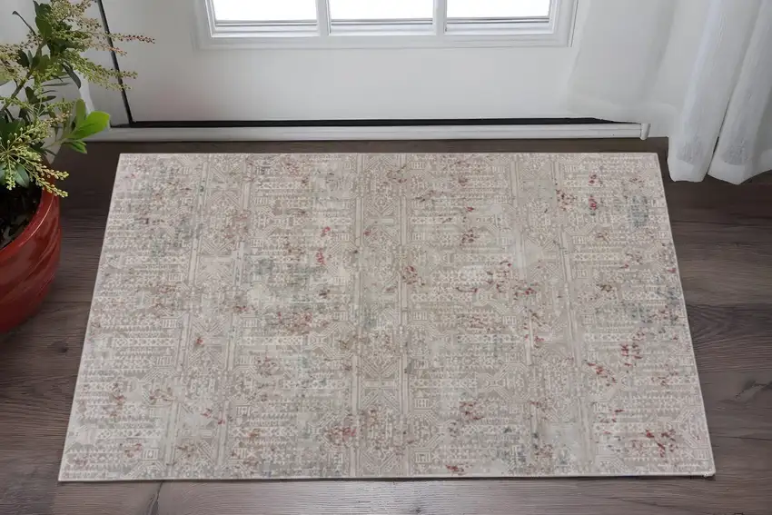 Gray And Ivory Geometric Distressed Stain Resistant Area Rug Photo 1