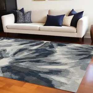Photo of 8'x11' Ivory Blue Machine Woven Oversized Floral Indoor Area Rug