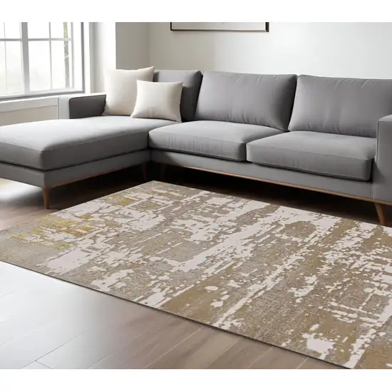 Ivory Taupe And Gold Abstract Area Rug Photo 2