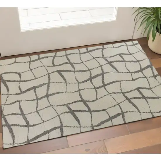 Ivory And Dark Gray Abstract Shag Area Rug Photo 1