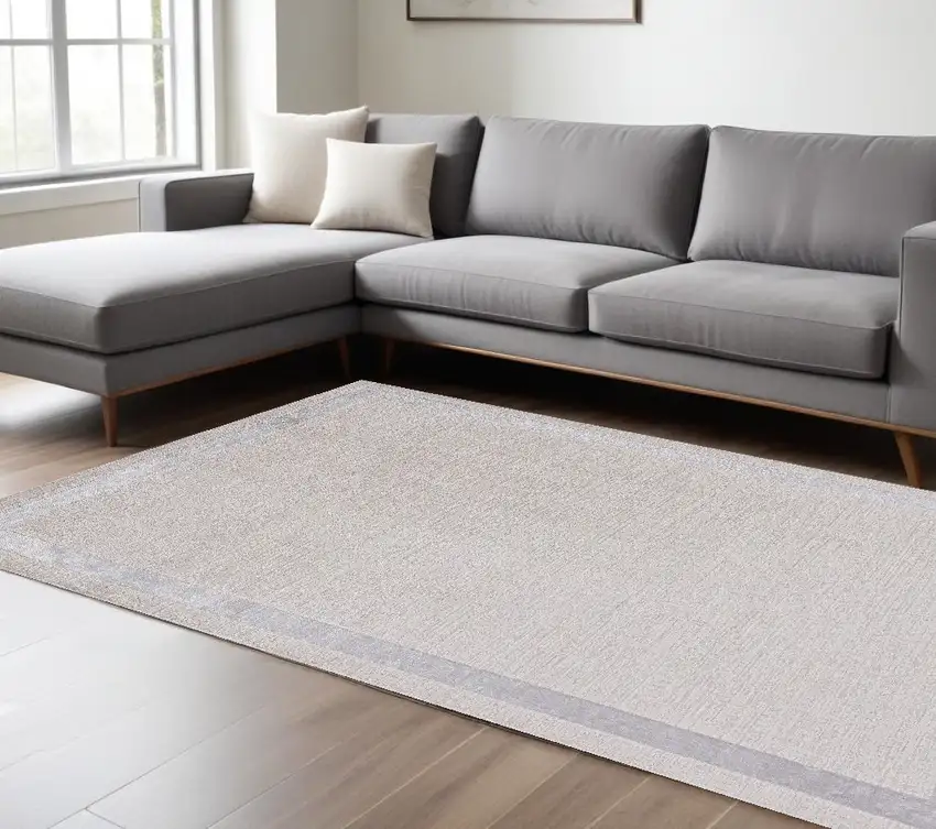 Ivory Silver Machine Woven Bordered Indoor Area Rug Photo 1