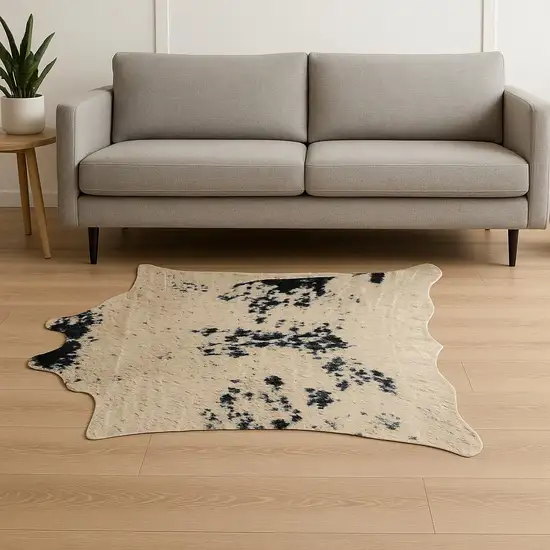 Black Gold And Off White Faux Cowhide Animal Print Washable Area Rug Photo 1