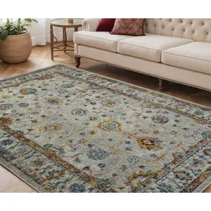 Photo of 5' x 7' Orange and Ivory Floral Power Loom Area Rug