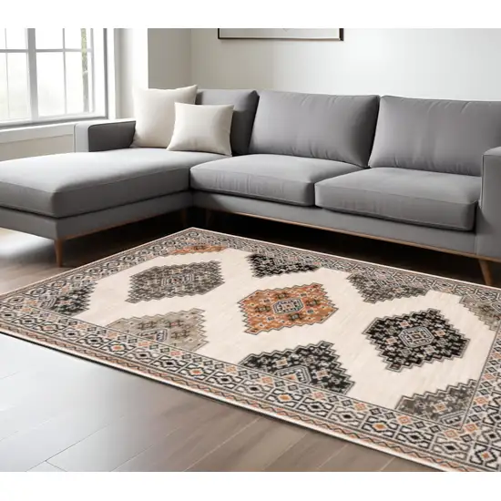 Ivory Gray And Orange Geometric Distressed Area Rug Photo 1