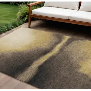 Photo of Amber Black And Brown Abstract Washable Indoor Outdoor Area Rug