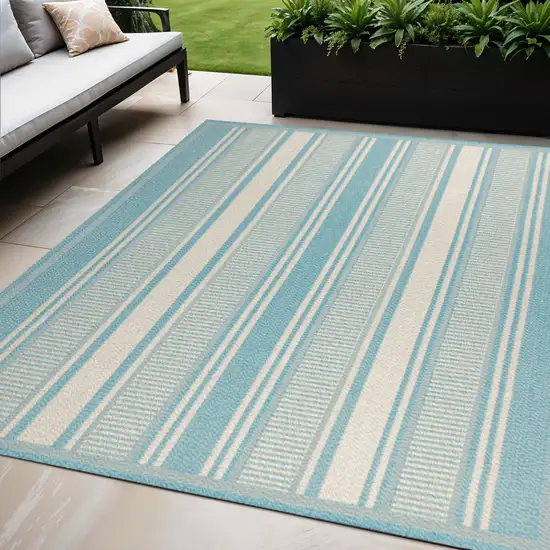 Aqua And Beige Striped Indoor Outdoor Area Rug Photo 1