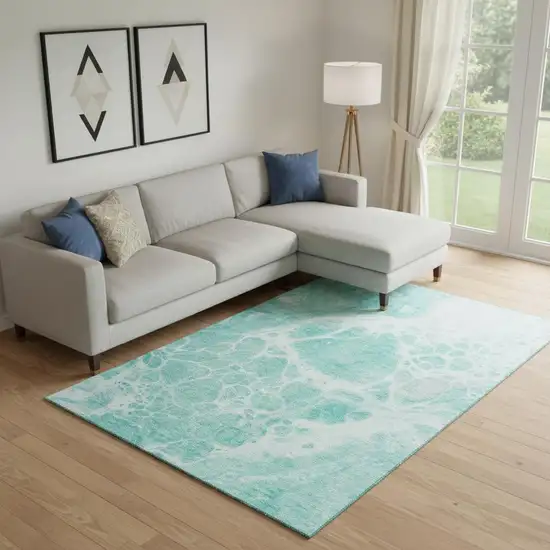 Aqua And Ivory Abstract Washable Area Rug With UV Protection Photo 1