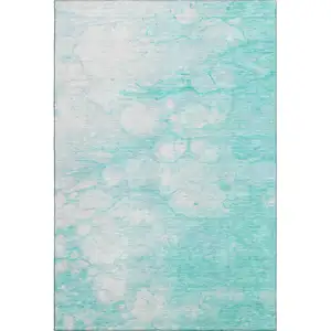 Photo of Aqua And Ivory Abstract Washable Area Rug With UV Protection