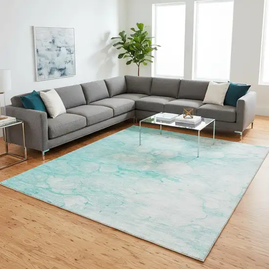 Aqua And Ivory Abstract Washable Area Rug With UV Protection Photo 1