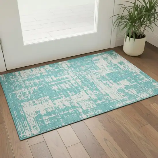 Aqua And Ivory Abstract Washable Area Rug With UV Protection Photo 1