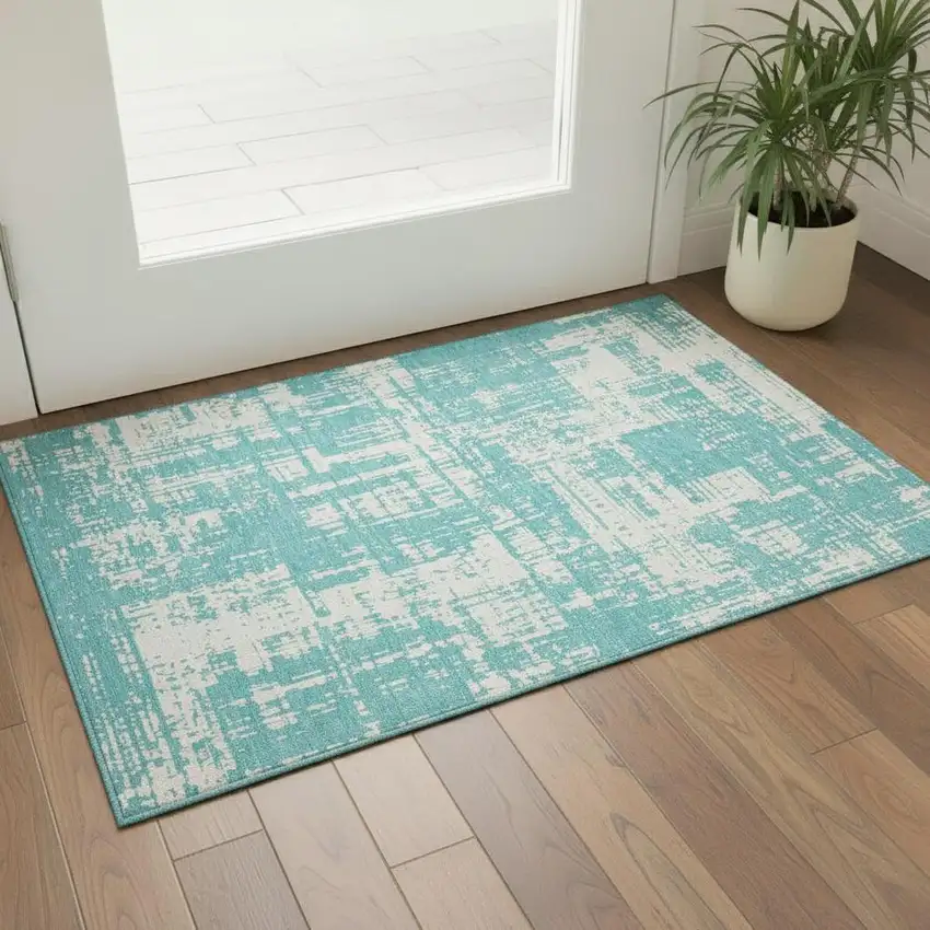 Aqua And Ivory Abstract Washable Area Rug With UV Protection Photo 1