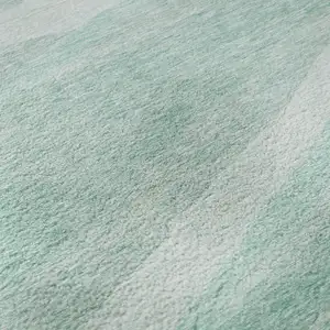 Photo of Aqua And Ivory Abstract Washable Area Rug With UV Protection