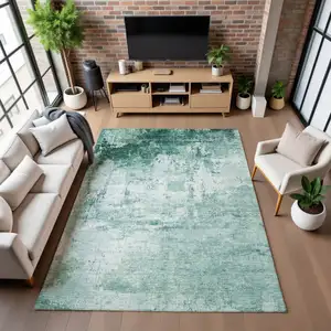 Photo of Aqua And Ivory Abstract Washable Area Rug With UV Protection