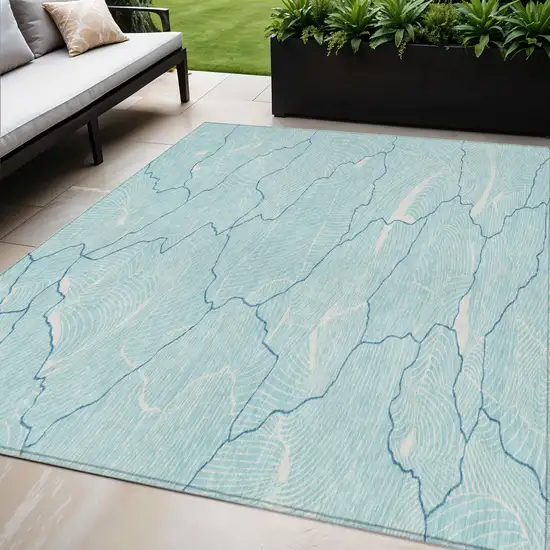 Aqua And Ivory Abstract Washable Indoor Outdoor Area Rug Photo 1