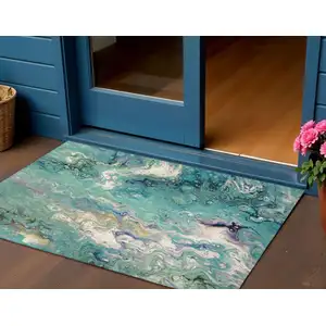 Photo of Aqua And Ivory Abstract Washable Indoor Outdoor Area Rug