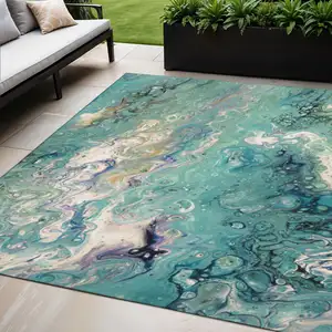 Photo of Aqua And Ivory Abstract Washable Indoor Outdoor Area Rug