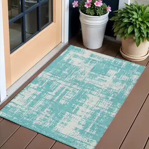 Photo of Aqua And Ivory Abstract Washable Indoor Outdoor Area Rug