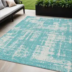 Photo of Aqua And Ivory Abstract Washable Indoor Outdoor Area Rug