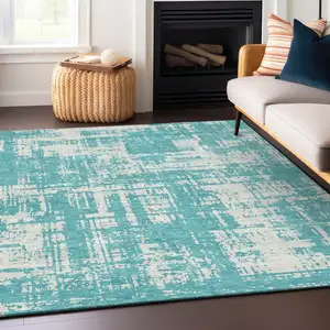 Photo of Aqua And Ivory Abstract Washable Indoor Outdoor Area Rug