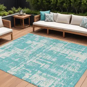 Photo of Aqua And Ivory Abstract Washable Indoor Outdoor Area Rug