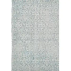 Photo of Aqua And Ivory Damask Washable Area Rug With UV Protection
