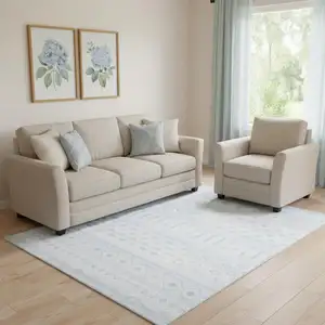 Photo of Aqua And Ivory Geometric Distressed Washable Area Rug