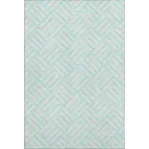 Photo of Aqua And Ivory Geometric Washable Area Rug With UV Protection