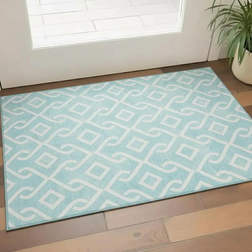 Aqua And Ivory Geometric Washable Area Rug With UV Protection Photo 1