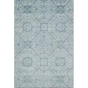 Photo of Aqua And Ivory Geometric Washable Area Rug With UV Protection