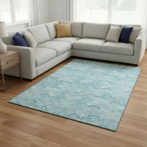Photo of Aqua And Ivory Geometric Washable Area Rug With UV Protection