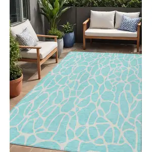 Photo of Aqua And Ivory Geometric Washable Indoor Outdoor Area Rug