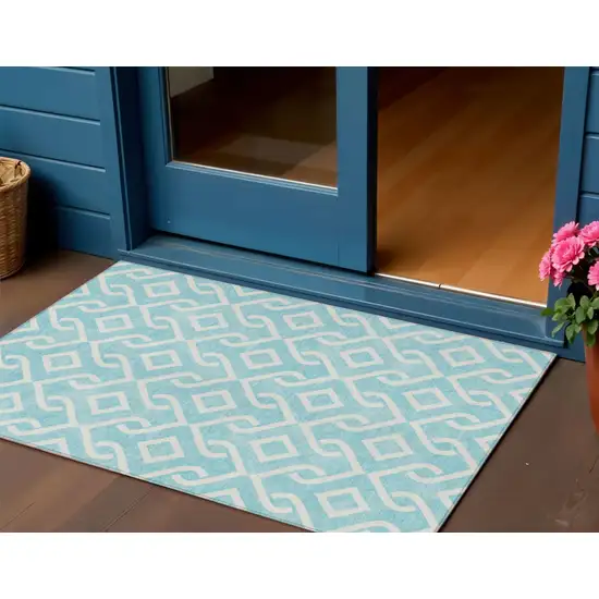 Aqua And Ivory Geometric Washable Indoor Outdoor Area Rug Photo 1