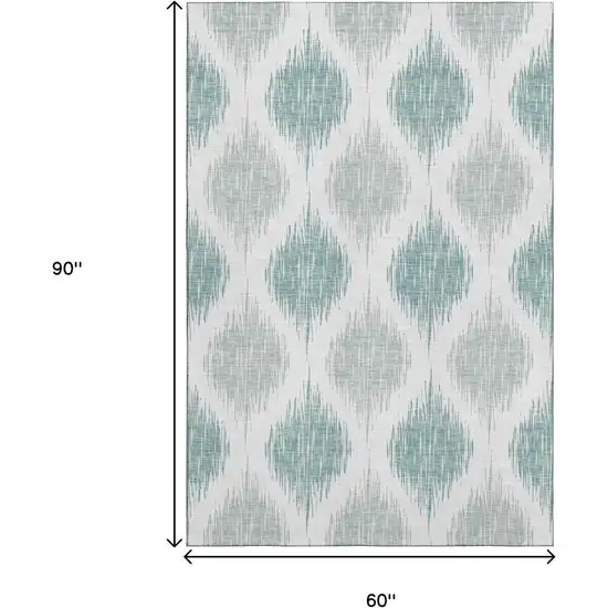 Aqua And Ivory Ikat Washable Area Rug With UV Protection Photo 3