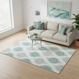 Photo of Aqua And Ivory Ikat Washable Area Rug With UV Protection