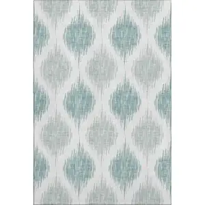 Photo of Aqua And Ivory Ikat Washable Area Rug With UV Protection