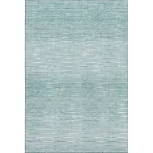 Photo of Aqua And Teal Abstract Washable Area Rug With UV Protection