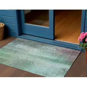 Photo of Aqua And Teal Blue Abstract Washable Indoor Outdoor Area Rug