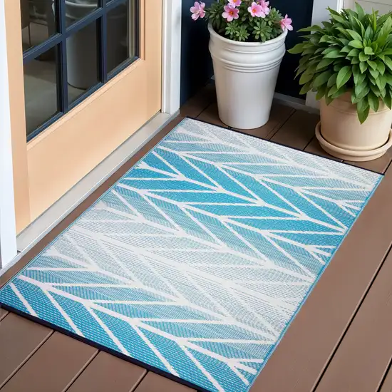 Aqua Geometric Machine Braided Distressed Area Rug With UV Protection Photo 1