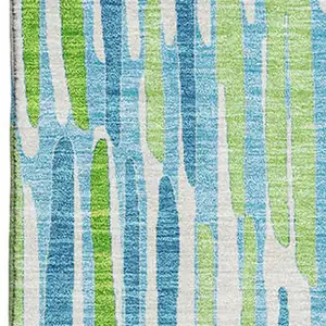Photo of Aqua Green And Ivory Abstract Washable Area Rug With UV Protection