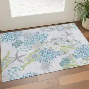 Photo of Aqua Ivory And Green Geometric Washable Area Rug With UV Protection
