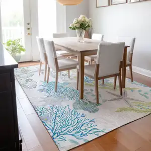 Photo of Aqua Ivory And Green Geometric Washable Area Rug With UV Protection
