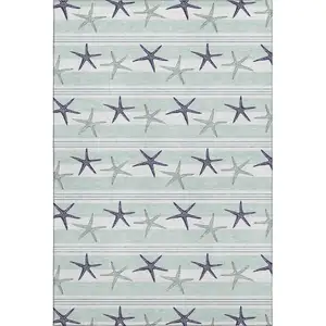 Photo of Aqua Navy Blue And Ivory Geometric Washable Area Rug With UV Protection