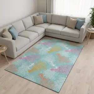 Photo of Aqua Orange And Pink Geometric Washable Area Rug With UV Protection